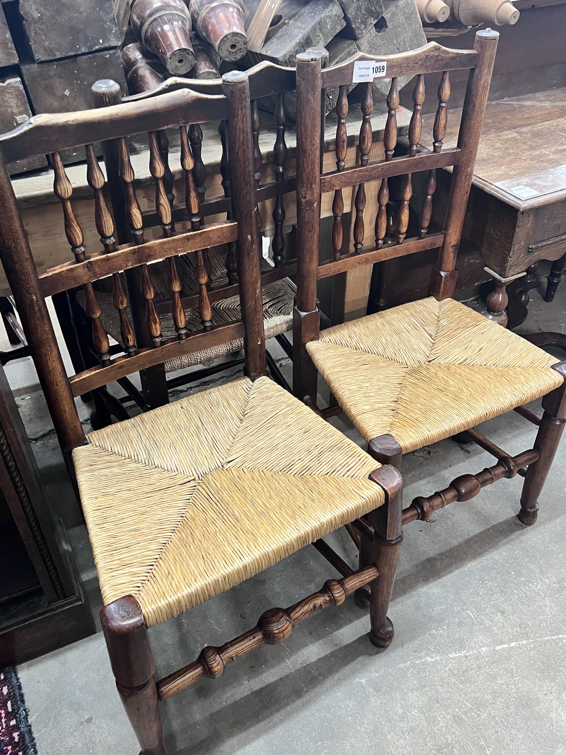 A harlequin set of six 19th century Lancashire ash and beach rush seat spindle back dining chairs